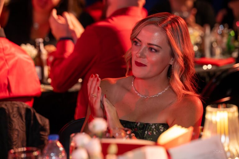 Guest applauding at her table
