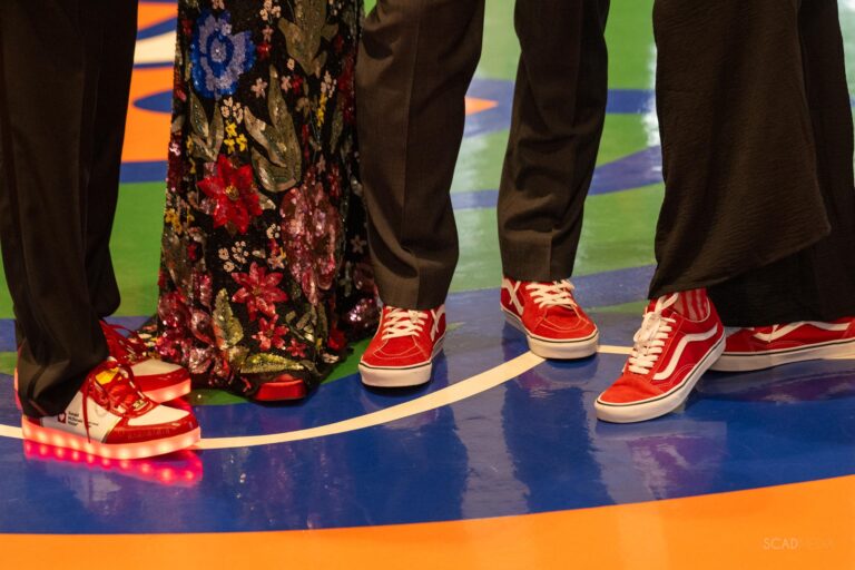 Guests wearing red sneakers, including a light-up pair