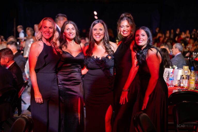 Five guests in black gowns